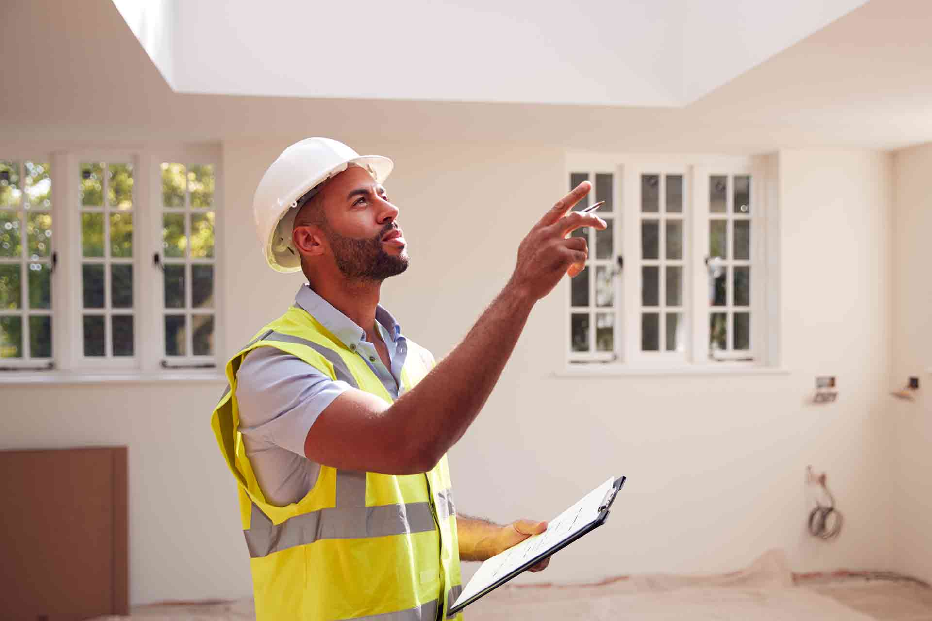 Third Party Wall Surveyors Kingston upon Hull reviewing plans between two parties during a dispute